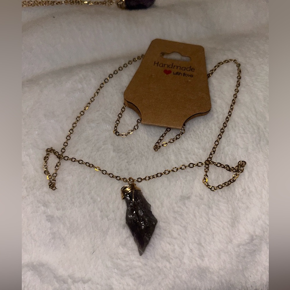 Gold chain with amethyst crystal pendant